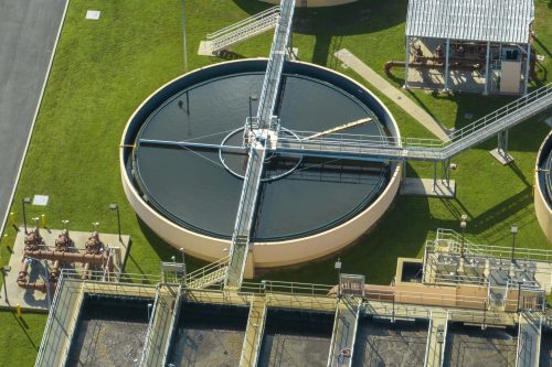 Aerial view of water treatment factory at city wastewater cleaning facility. Purification process of removing undesirable chemicals, suspended solids and gases from contaminated liquid